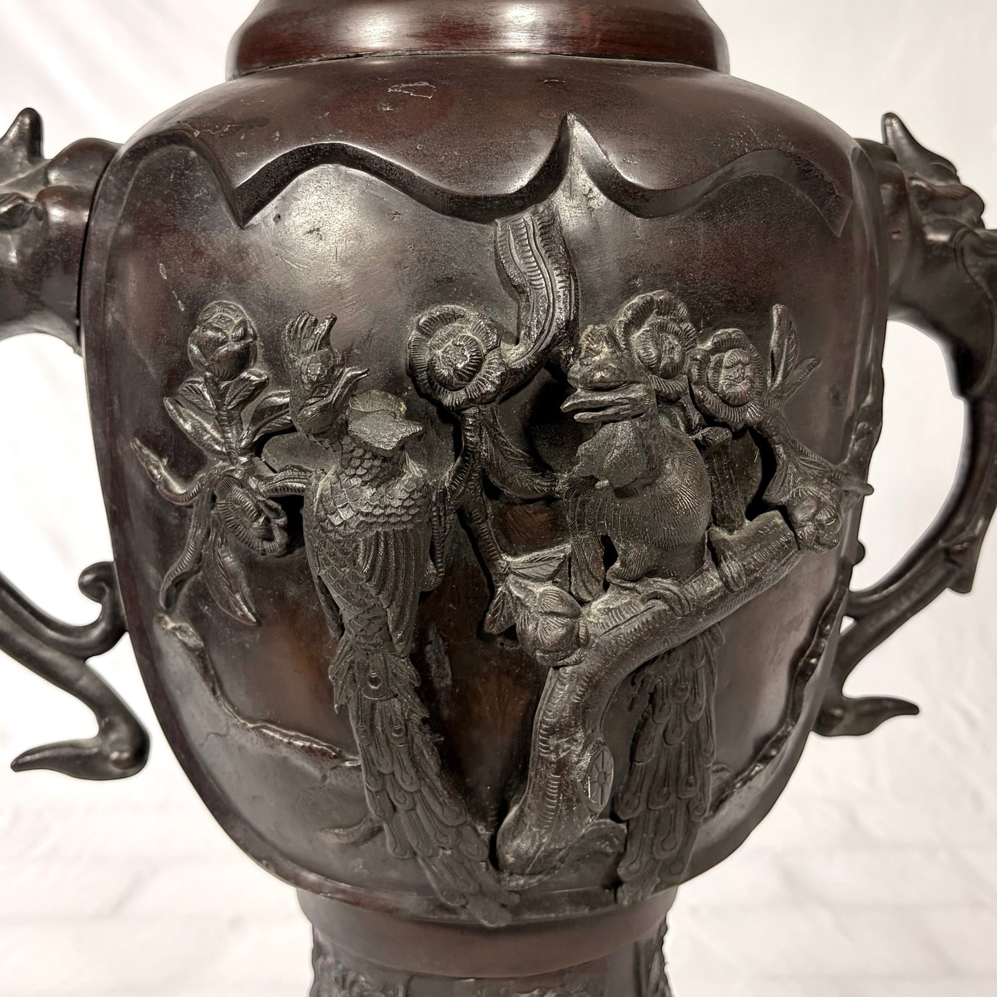 KLS Vaults antique Japanese bronze vase featuring high-relief phoenix and floral carvings with shishi head handles.