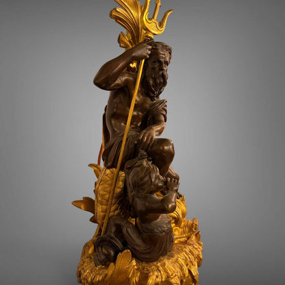 KLS Vaults antique French gilt bronze candelabra featuring Neptune and Triton figures with ornate sea foam detailing.