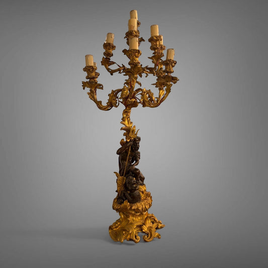 KLS Vaults 19th-century French gilt bronze and patinated bronze nine-light candelabra featuring Neptune and Triton.