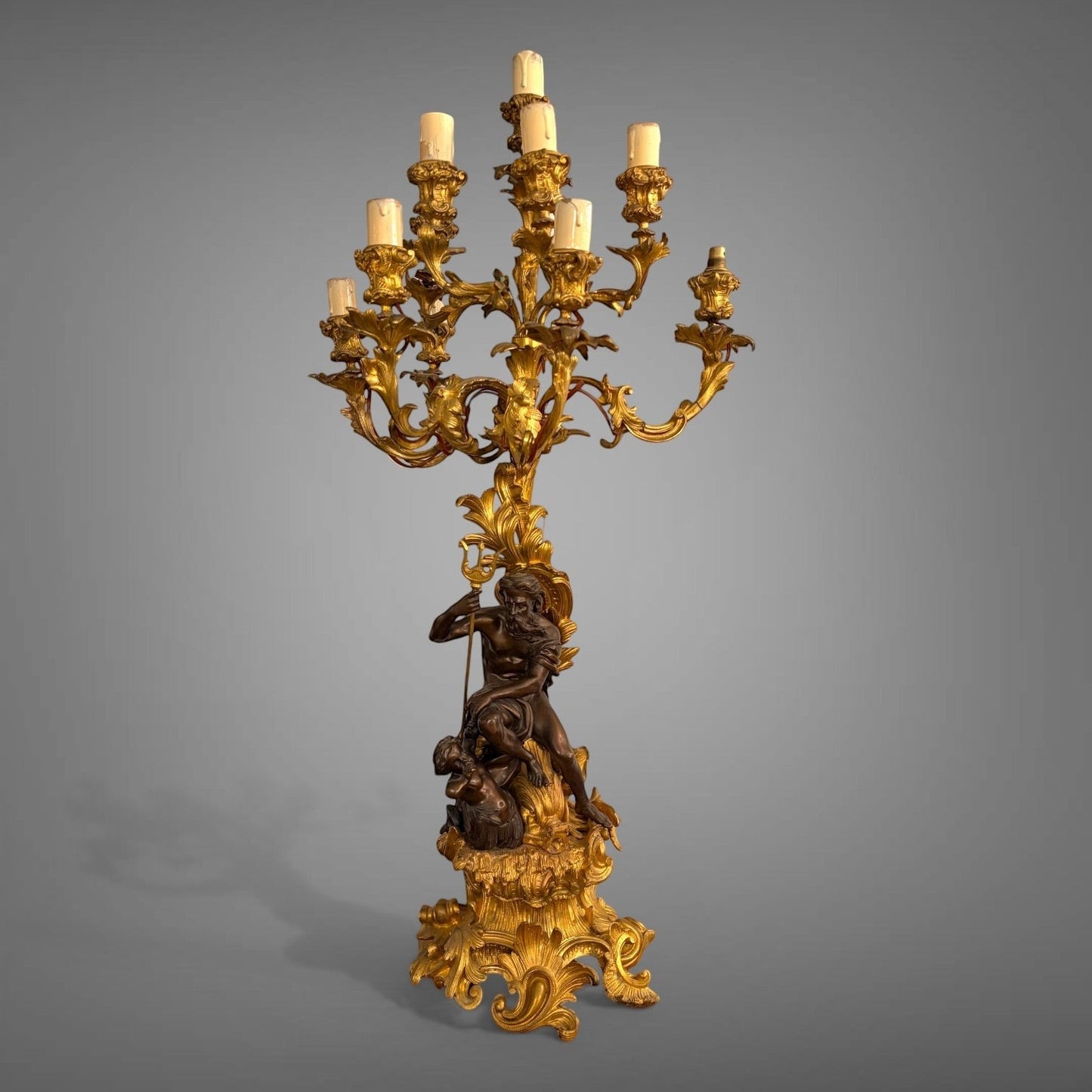 KLS Vaults 19th-century French gilt bronze and patinated bronze nine-light candelabra featuring Neptune and Triton.