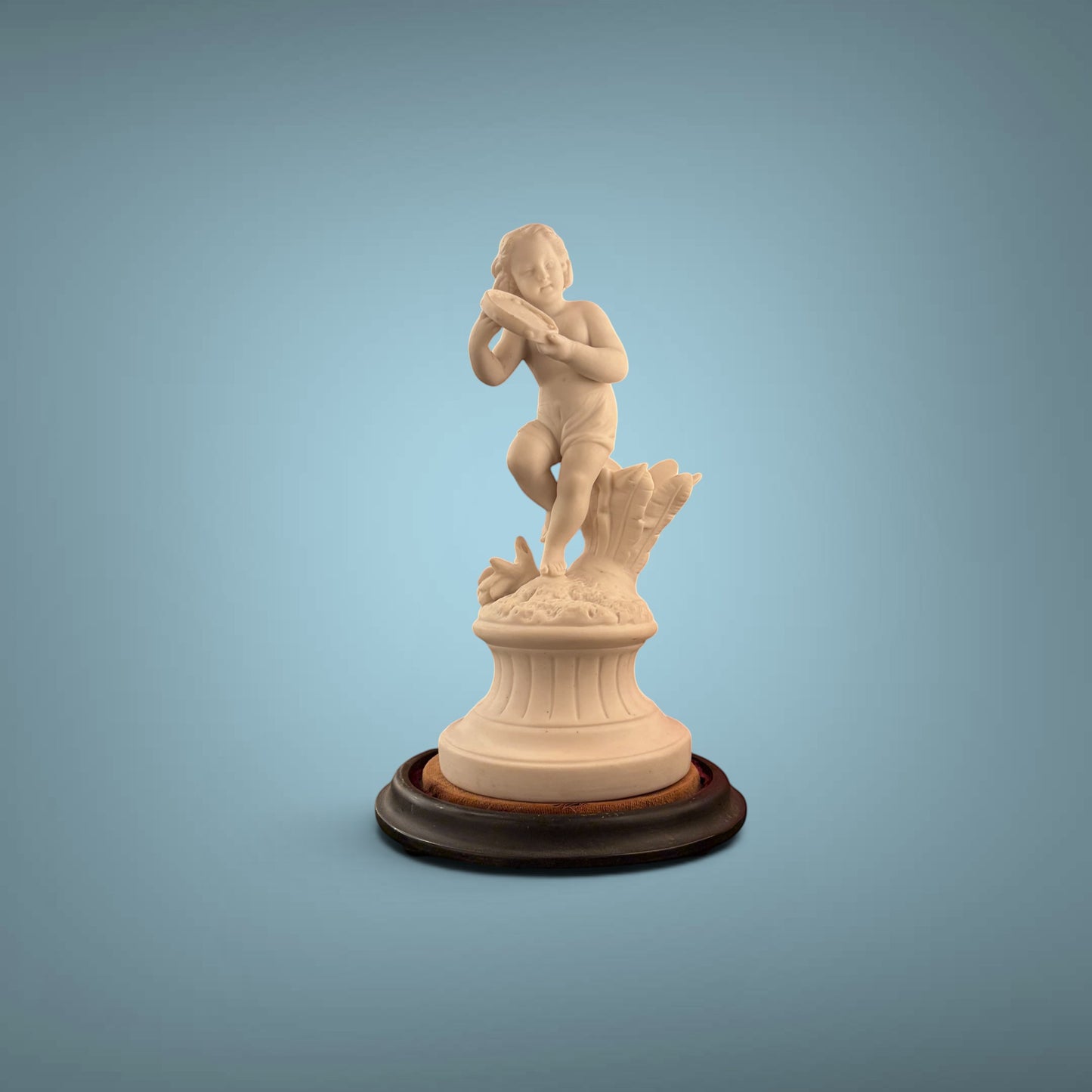 KLS Vaults 19th-century Parian ware putto statue playing a tambourine on an ebonised wood base.