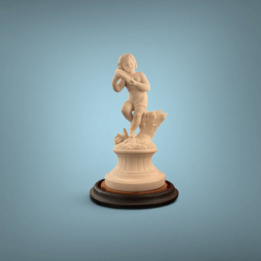 KLS Vaults 19th-century Parian ware putto statue playing a tambourine on an ebonised wood base.