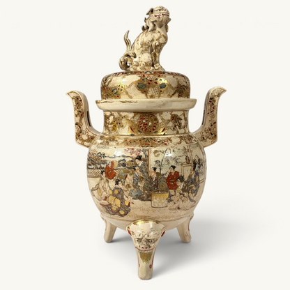 KLS Vaults Meiji period Satsuma incense burner with shishi finial, intricate gold brocade painting, and tripod feet.