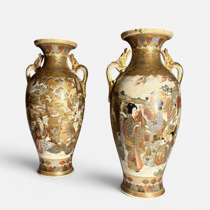 KLS Vaults pair of antique Japanese Satsuma vases with gilt dragon handles, depicting court ladies and samurai warriors in detailed kimono and armor.