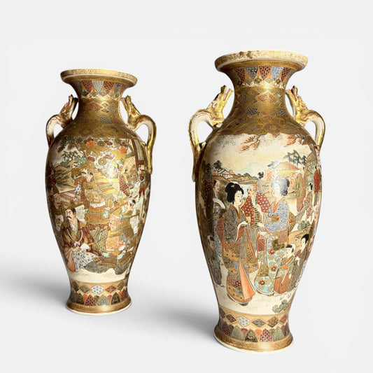 KLS Vaults pair of antique Japanese Satsuma vases with gilt dragon handles, depicting court ladies and samurai warriors in detailed kimono and armor.