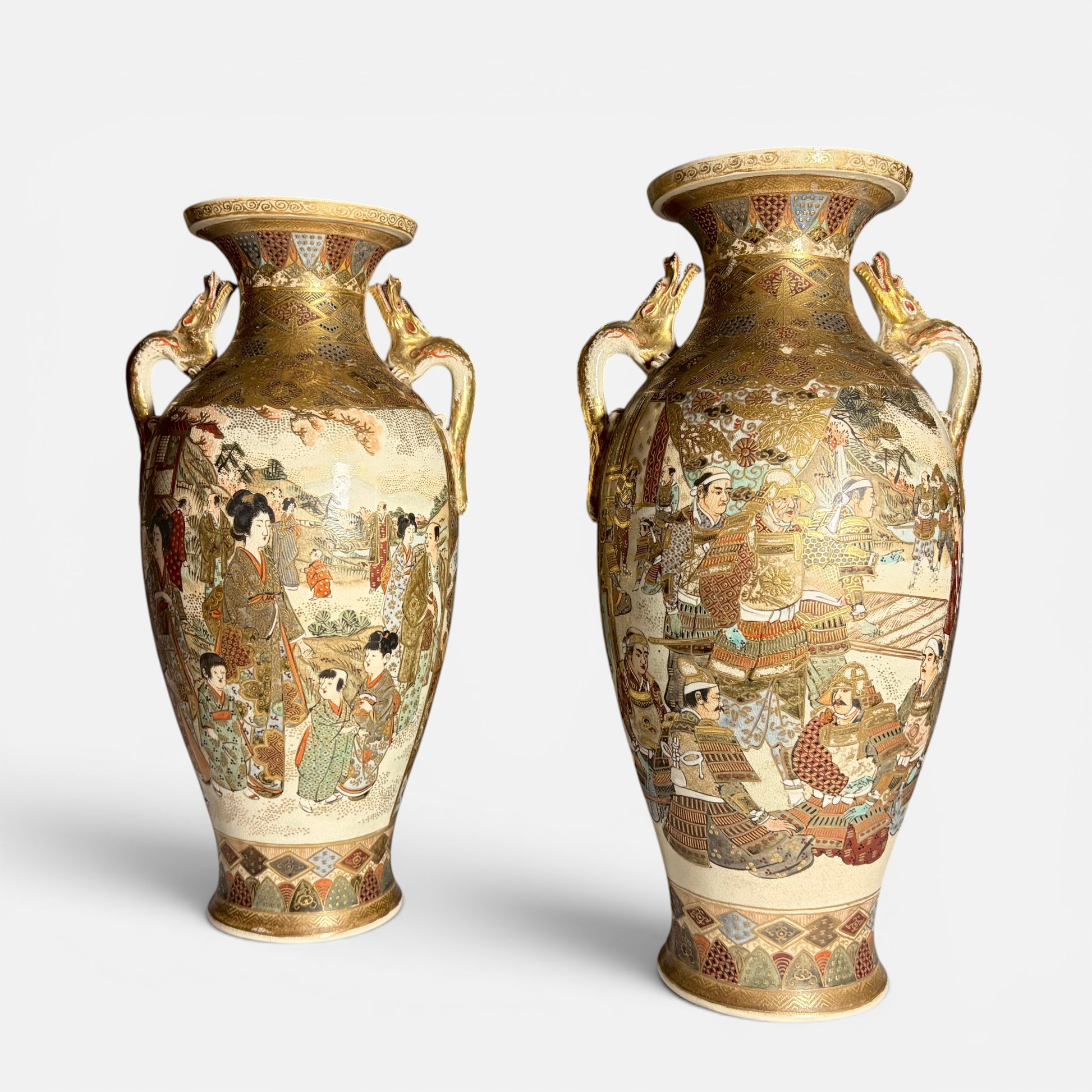KLS Vaults pair of antique Japanese Satsuma vases with gilt dragon handles, depicting court ladies and samurai warriors in intricate detail.