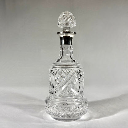 KLS Vaults large bell-shaped crystal decanter with sterling silver collar, diamond-cut glass, and faceted stopper.