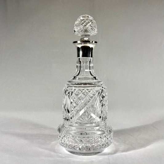 KLS Vaults large bell-shaped crystal decanter with sterling silver collar, diamond-cut glass, and faceted stopper.