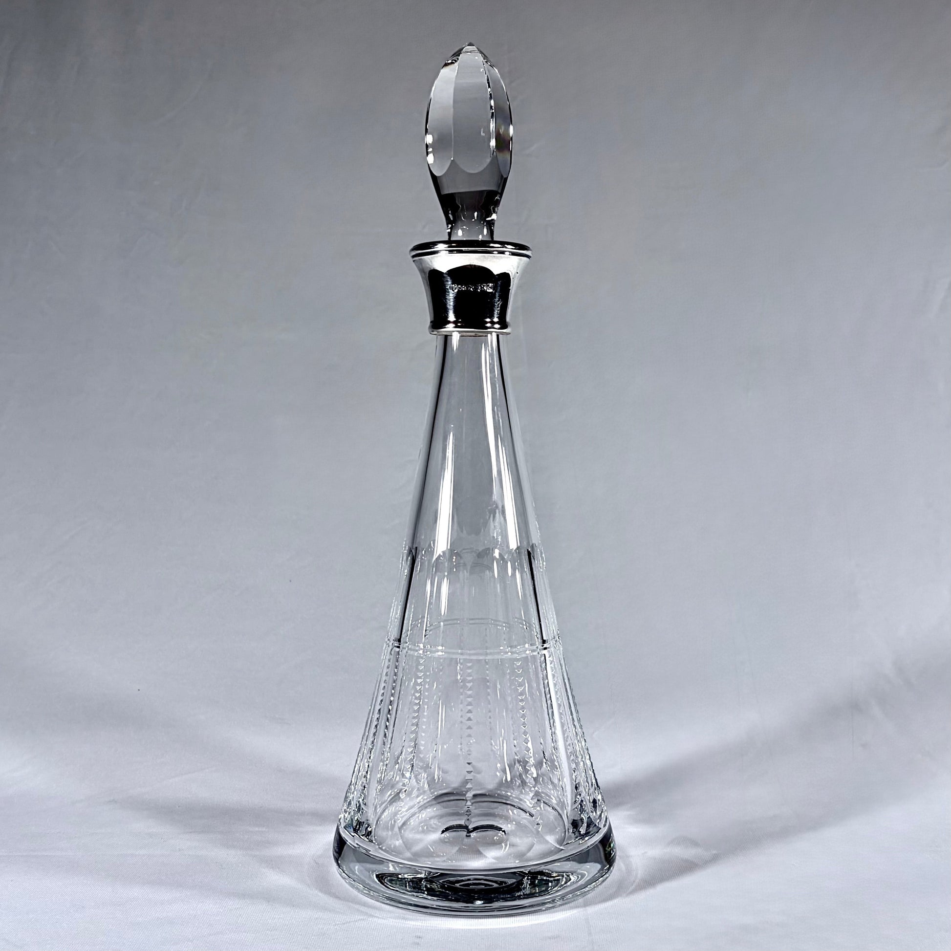 KLS Vaults Elizabeth II lead crystal conical decanter with sterling silver collar and faceted crystal stopper.