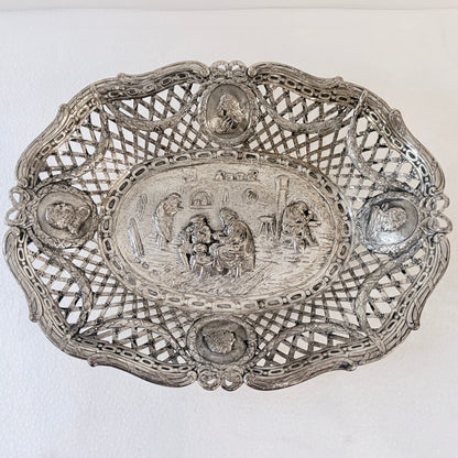 KLS Vaults 19th-century .800 silver reticulated centerpiece with repoussé tavern scene and portrait medallions.