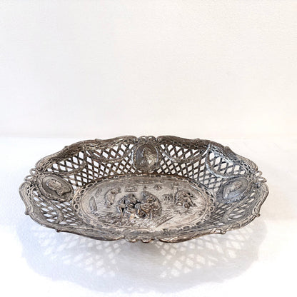 KLS Vaults 19th-century .800 silver reticulated centerpiece with repoussé tavern scene and portrait medallions.