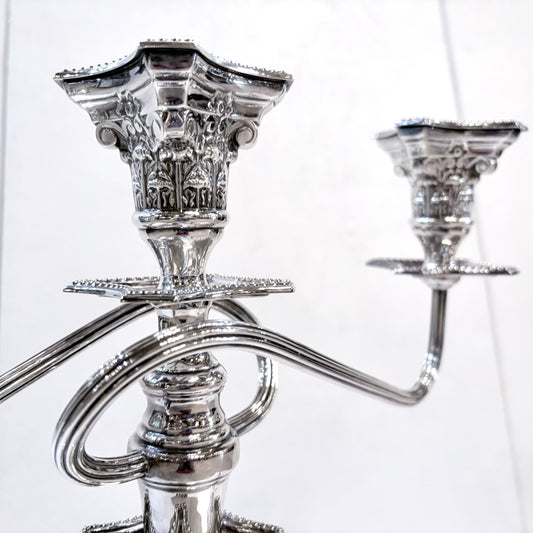 KLS Vaults pair of George III style sterling silver three-light candelabra with ornate Corinthian column design.