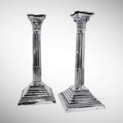 KLS Vaults pair of 1964 sterling silver Corinthian column candlesticks with fluted shafts and acanthus leaf capitals.