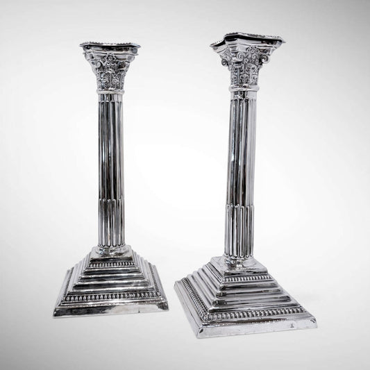 KLS Vaults pair of 1964 sterling silver Corinthian column candlesticks with fluted shafts and acanthus leaf capitals.