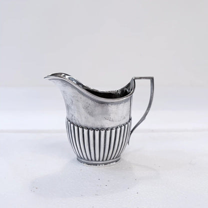 KLS Vaults Edwardian sterling silver cream jug with gadrooned base and bead-and-reel border, Sheffield 1916.