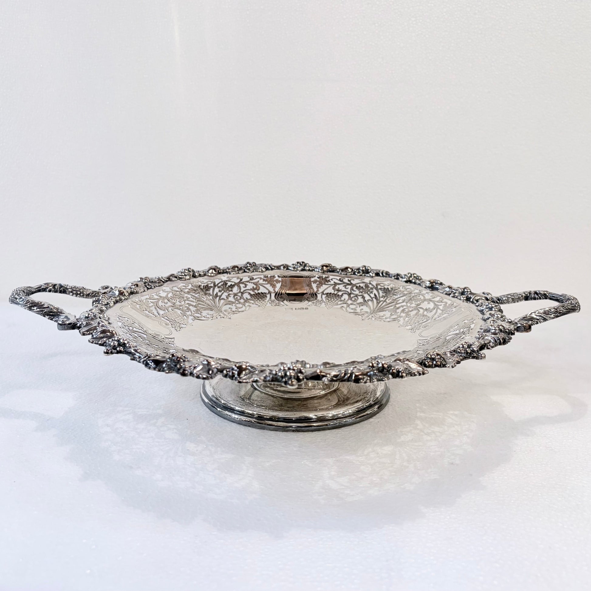 KLS Vaults 1960 sterling silver footed centerpiece bowl with intricate pierced lattice and grape vine repousse detail.