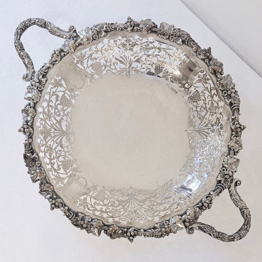 KLS Vaults 1960 sterling silver centerpiece bowl with intricate pierced lattice, grape motifs, and ornate handles.