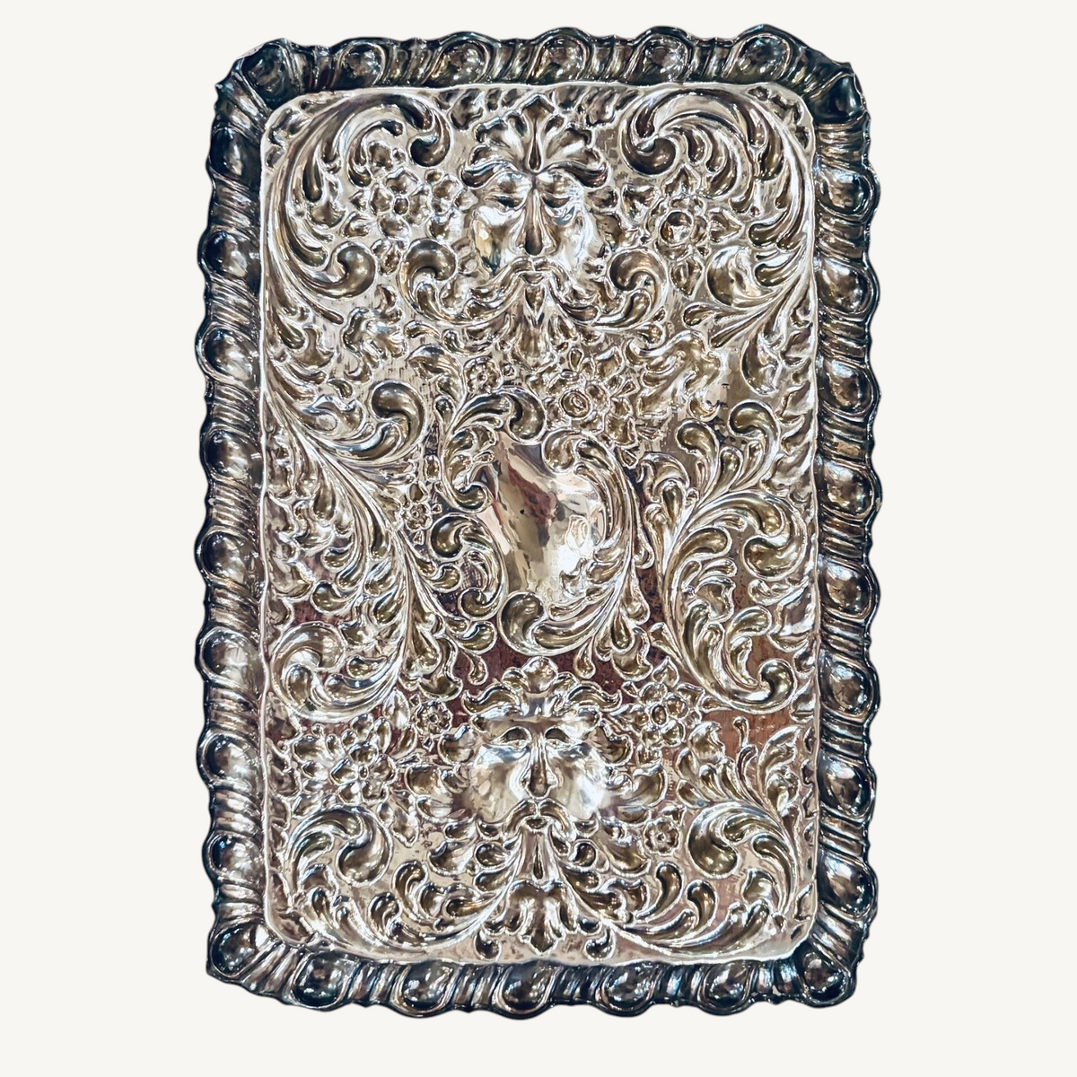 KLS Vaults 1927 George V sterling silver dressing tray with intricate repoussé floral, scroll, and Green Man mask motifs.