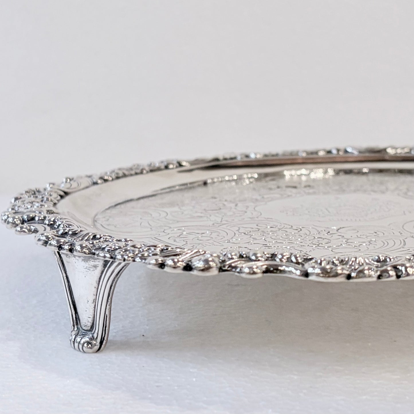 KLS Vaults 1831 William IV sterling silver salver with ornate acanthus leaf border and intricate flat-chased detail.