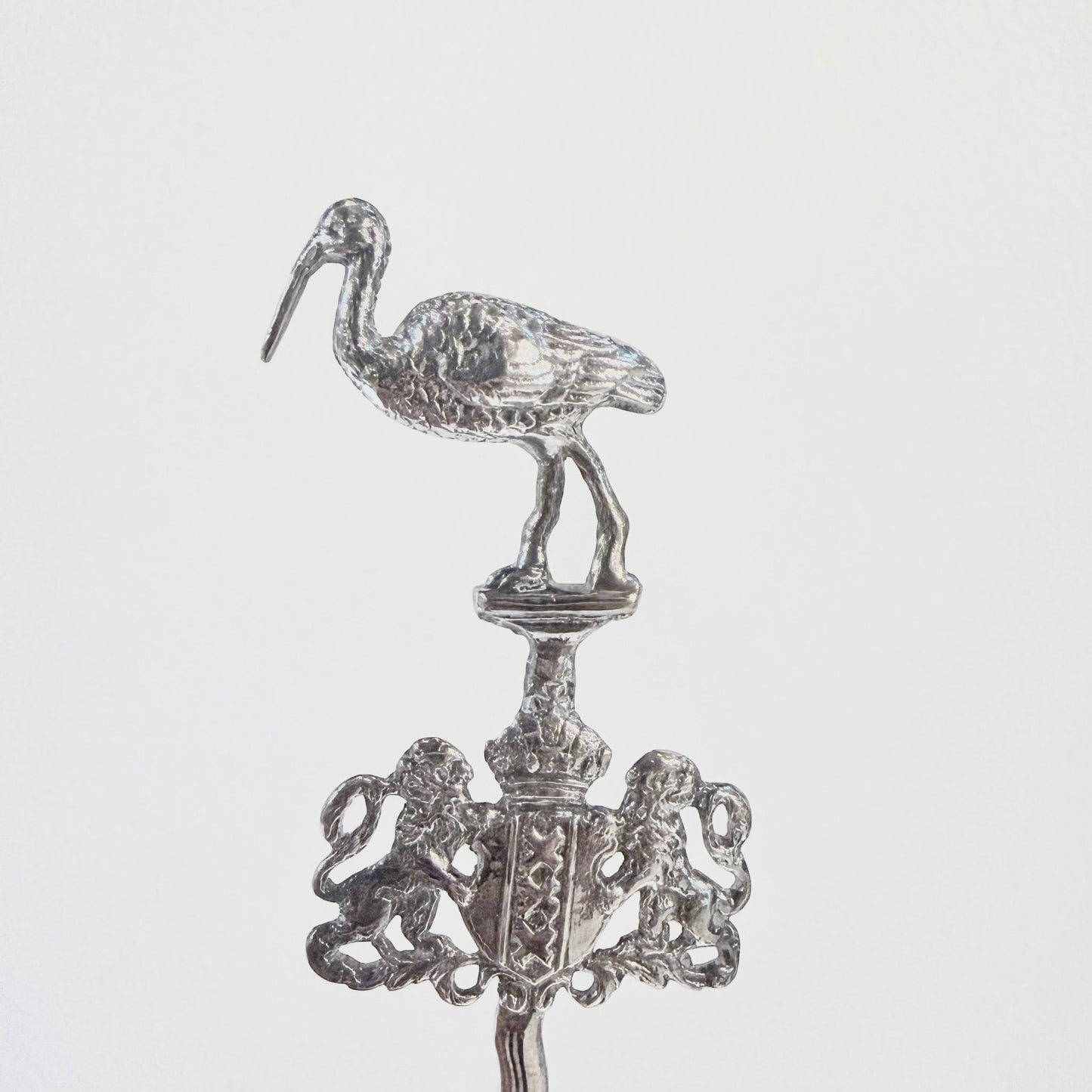 KLS Vaults Edwardian sterling silver marriage spoon featuring a detailed stork finial and Amsterdam City Arms crest.