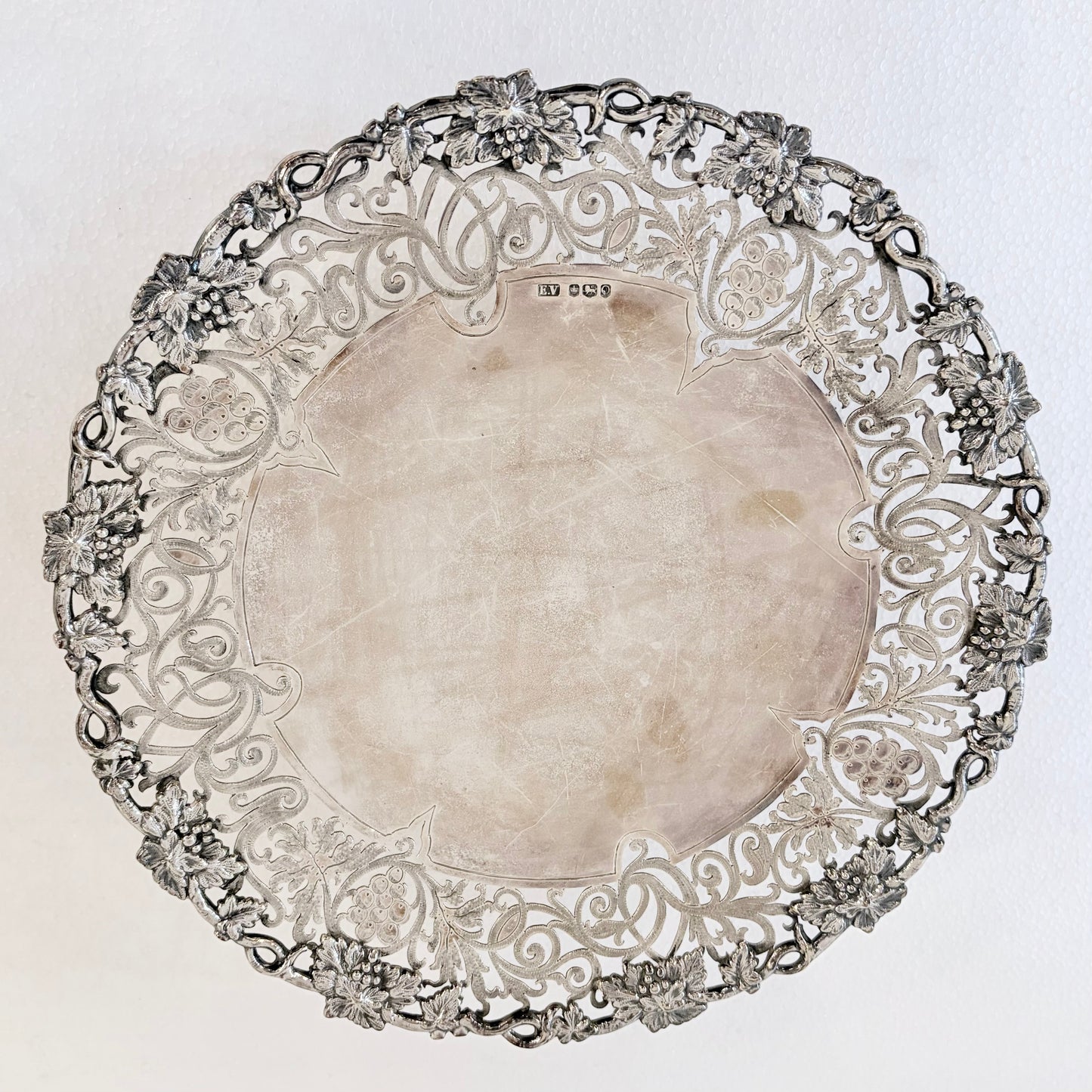 KLS Vaults 1959 sterling silver tazza with intricate pierced grape and vine border and polished central well.