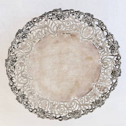 KLS Vaults 1959 sterling silver tazza with intricate pierced grape and vine border and polished central well.