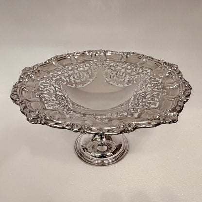 KLS Vaults 1913 sterling silver tazza with ornate pierced foliate bowl, shell rim, and pedestal base.