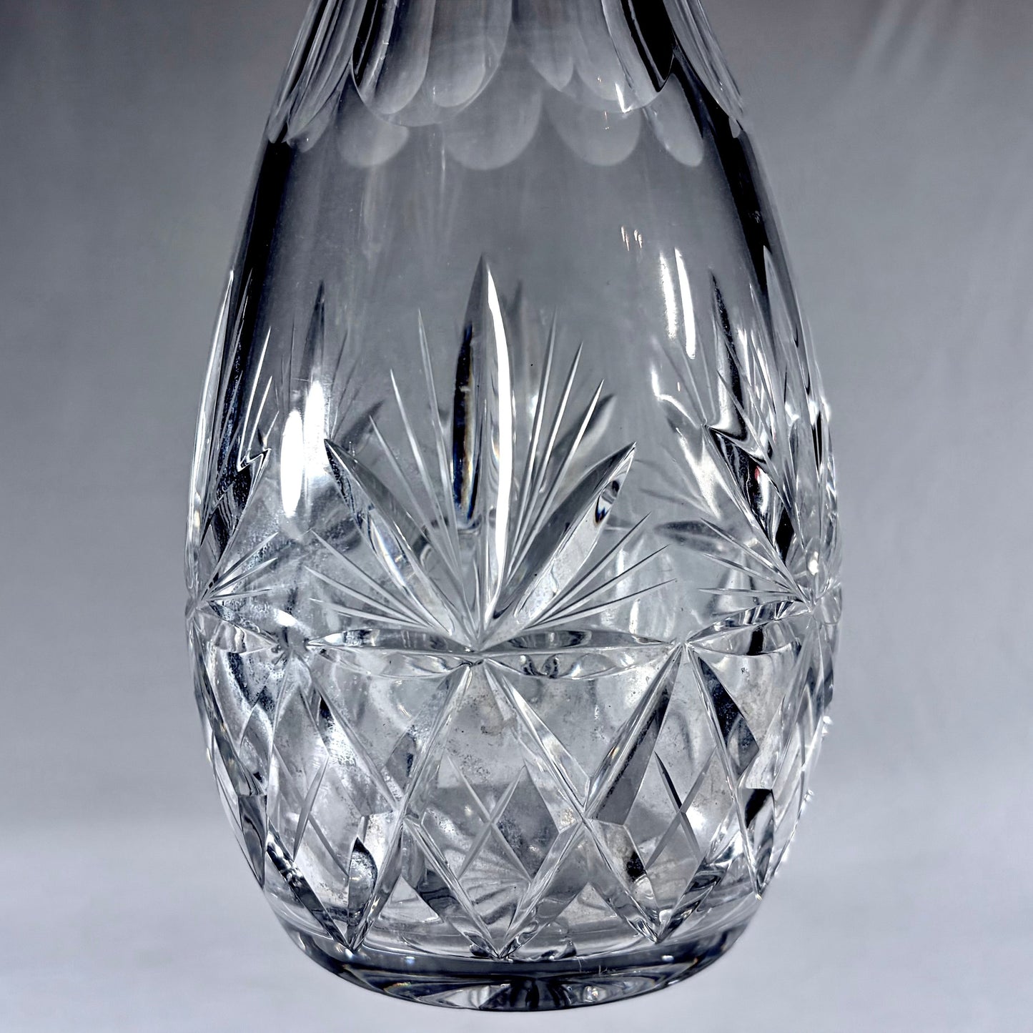 KLS Vaults large teardrop lead crystal decanter with deep-cut geometric patterns and silver mount from 1970