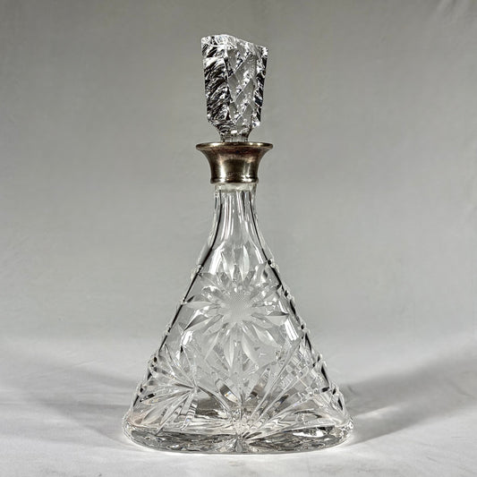 KLS Vaults triangular cut-glass decanter with sterling silver collar and geometric stopper, London 1968.