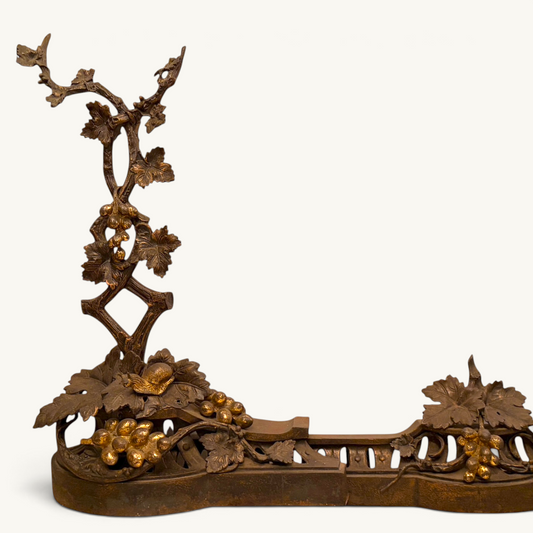 Victorian parcel-gilt bronze fireplace fender with grapevine motif, grapes, and snail details.