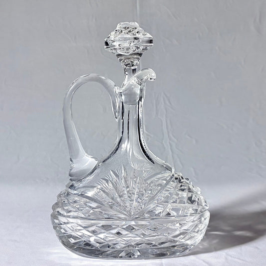 KLS Vaults late Victorian lead crystal claret jug with strawberry diamond cuts, starburst motifs, and glass stopper.