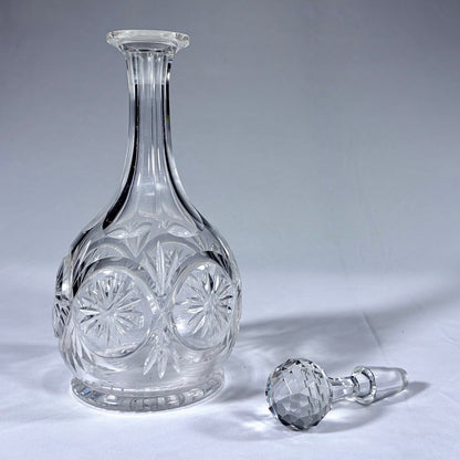 KLS Vaults late Victorian cut crystal spirit decanter with starburst rondelles and faceted spherical stopper.