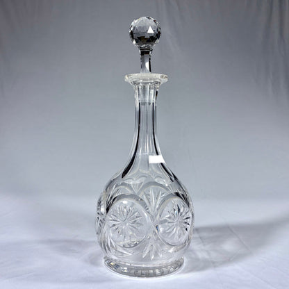 KLS Vaults late Victorian cut crystal spirit decanter with starburst motifs and a faceted spherical stopper.