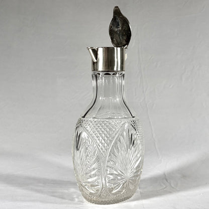 KLS Vaults Victorian claret jug with diamond-cut crystal body and sterling silver hinged lid, London 1896.