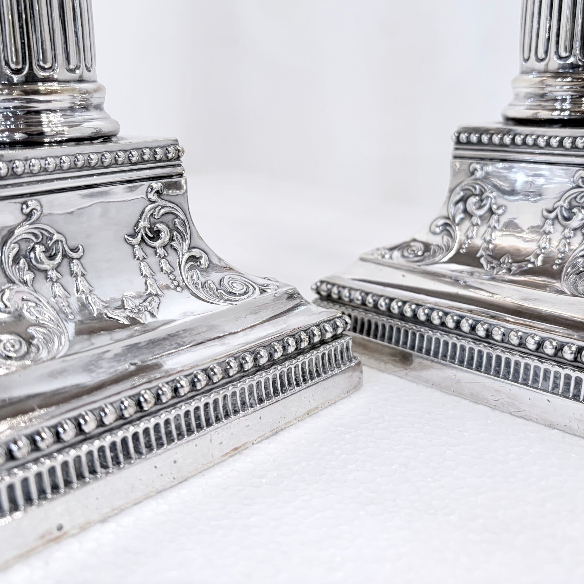 KLS Vaults pair of 1896 Victorian sterling silver Corinthian column candlesticks with ornate beaded square bases.