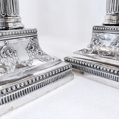 KLS Vaults pair of 1896 Victorian sterling silver Corinthian column candlesticks with ornate beaded square bases.