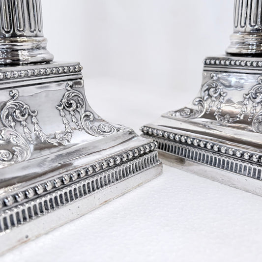KLS Vaults pair of 1896 Victorian sterling silver Corinthian column candlesticks with ornate beaded square bases.