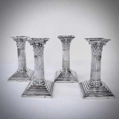 KLS Vaults set of four Victorian sterling silver Corinthian column candlesticks with acanthus leaf capitals.