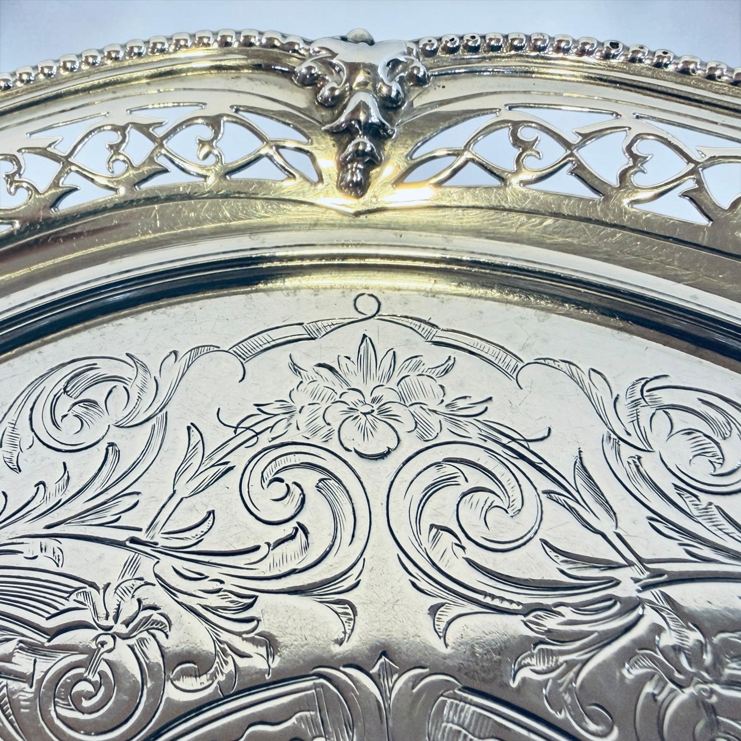 KLS Vaults Victorian sterling silver salver with intricate chased floral motifs and pierced fretwork gallery border.