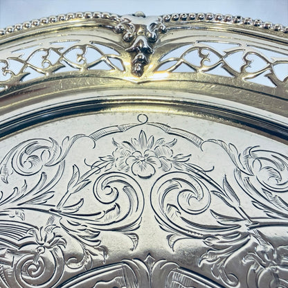 KLS Vaults Victorian sterling silver salver with intricate chased floral motifs and pierced fretwork gallery border.