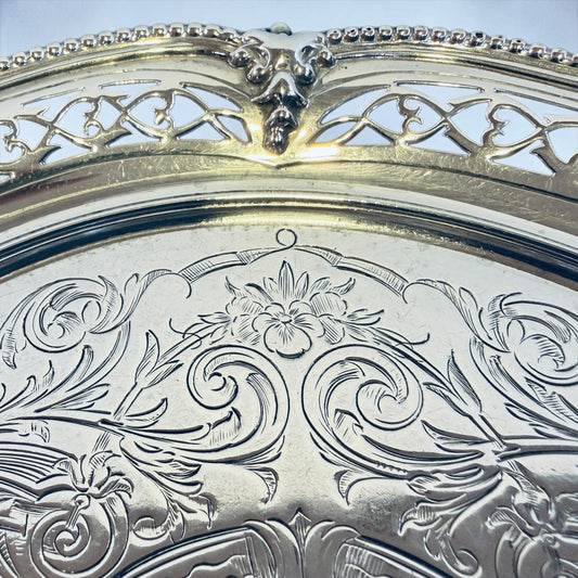 KLS Vaults Victorian sterling silver salver with intricate chased floral motifs and pierced fretwork gallery border.