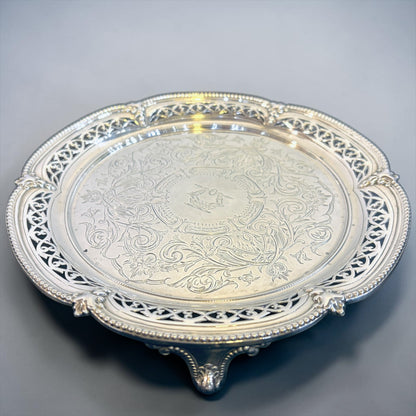KLS Vaults Victorian sterling silver salver with intricate chased floral motifs, pierced gallery, and scroll feet.