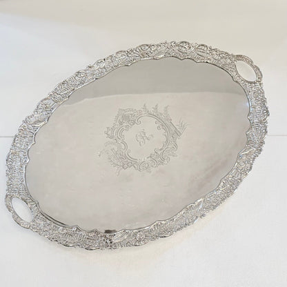 KLS Vaults Victorian sterling silver oval serving tray with intricate pierced border and engraved Rococo cartouche.