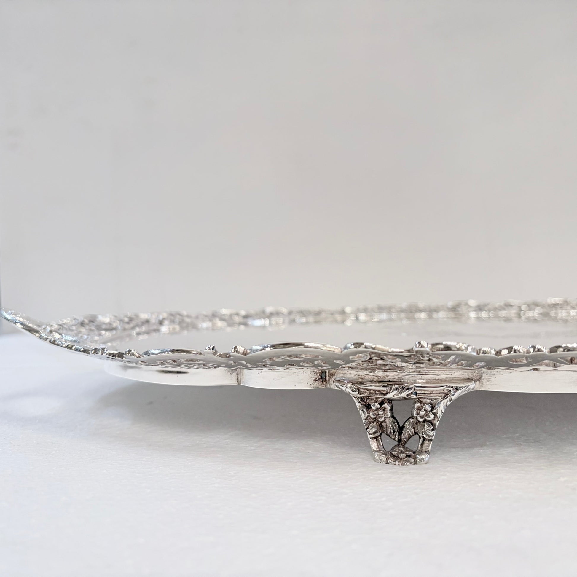 KLS Vaults Victorian sterling silver serving tray with intricate pierced border and ornate floral foot detail