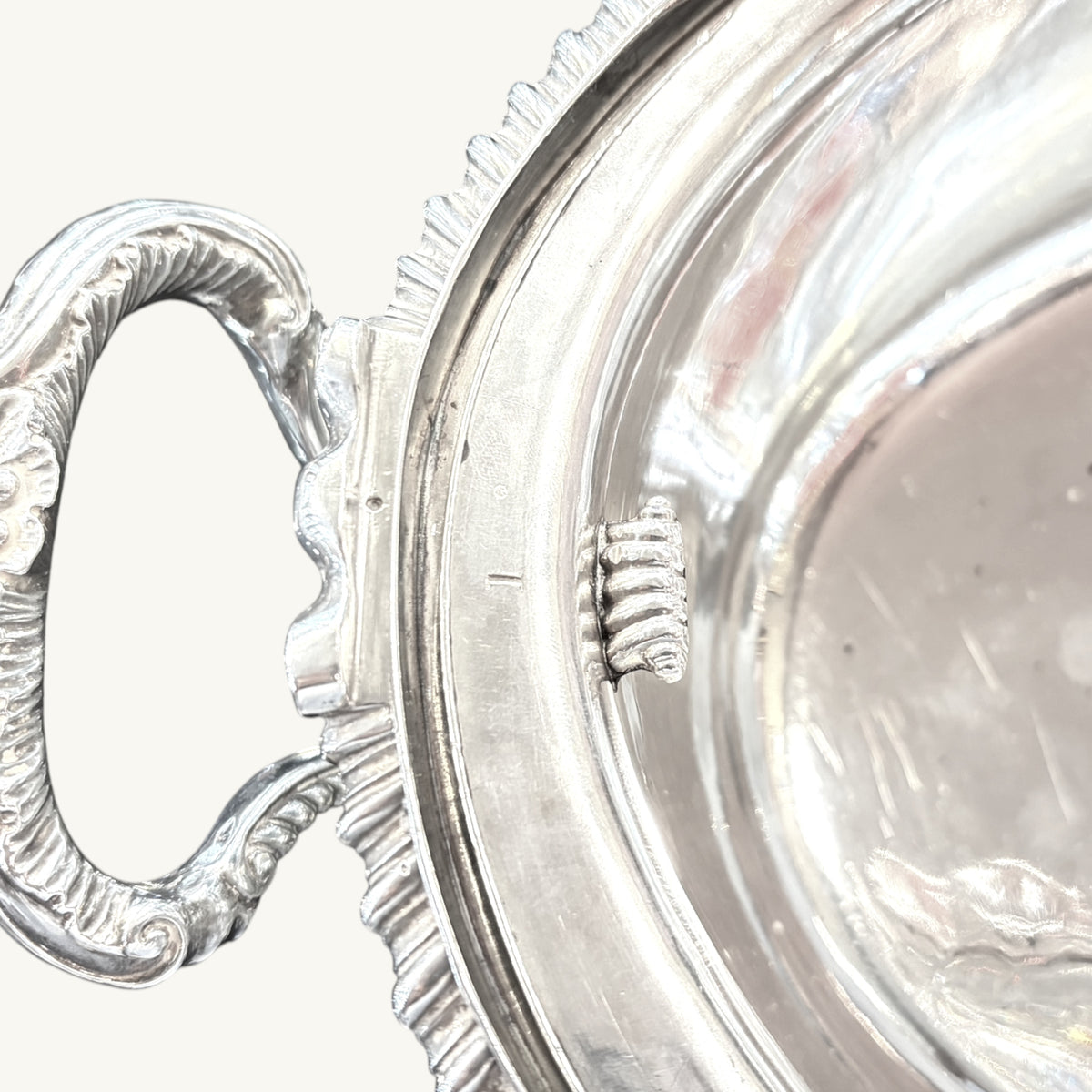 KLS Vaults Victorian silver soup tureen featuring ornate leaf-capped scroll handles and a detailed gadrooned rim.