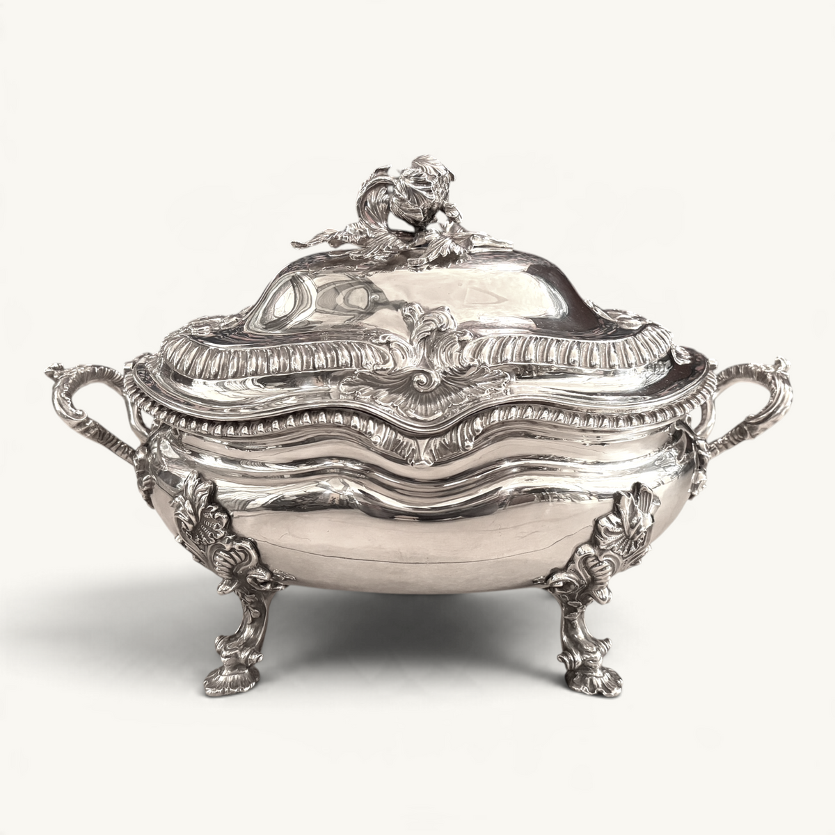 KLS Vaults Victorian silver soup tureen with ornate rococo handles, gadrooned rim, and artichoke finial, London 1841.
