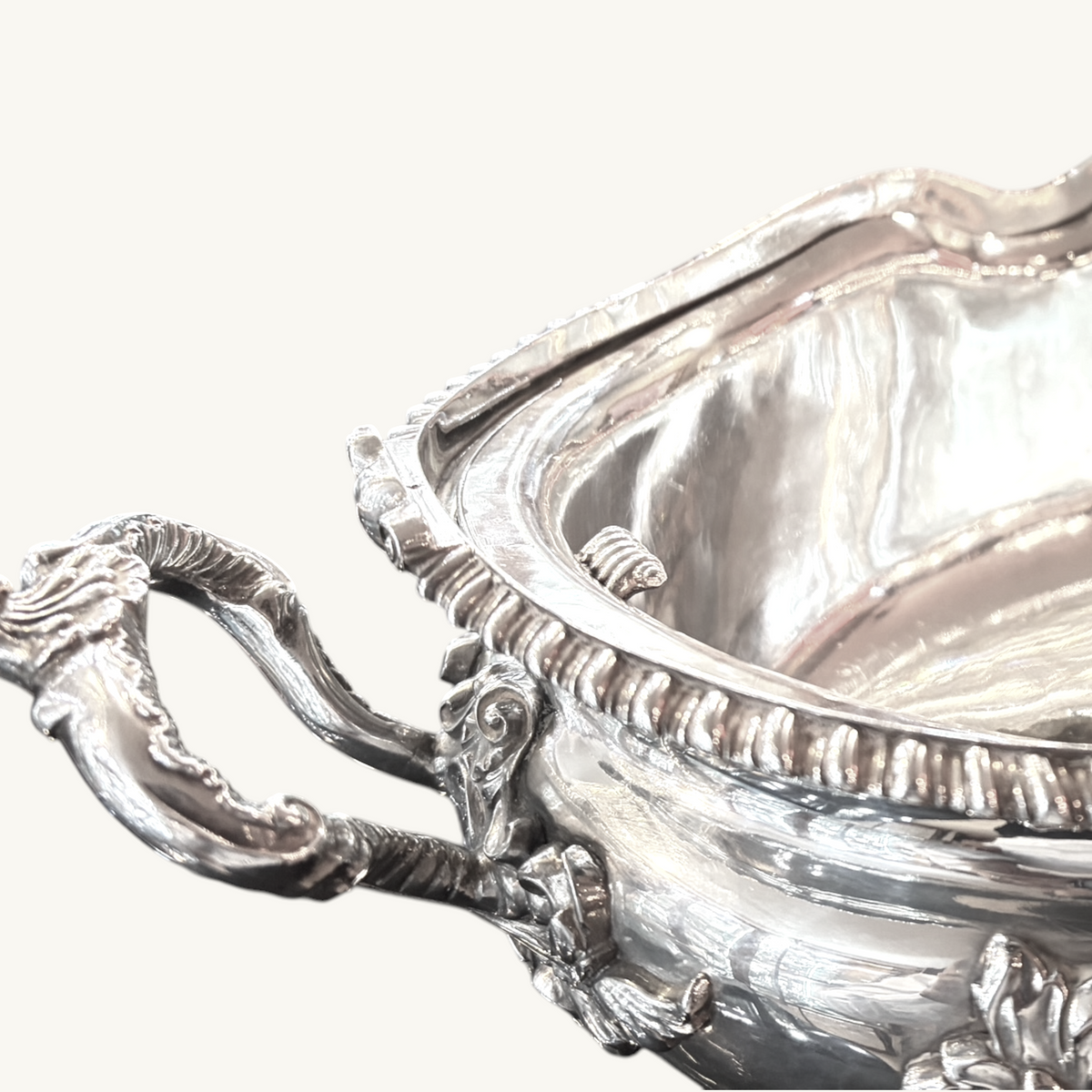 KLS Vaults Victorian silver soup tureen featuring ornate leaf-capped scroll handles and a gadrooned rim detail.
