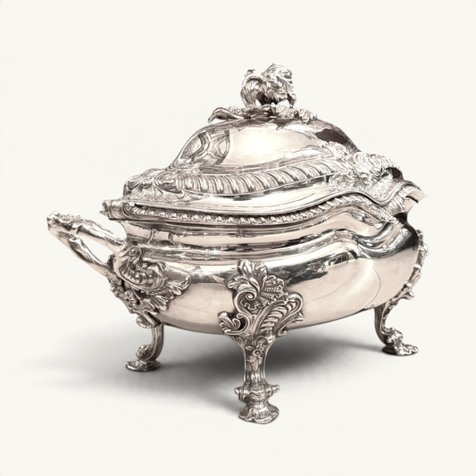 KLS Vaults Victorian silver soup tureen with ornate rococo handles, foliate legs, and a detachable artichoke finial.