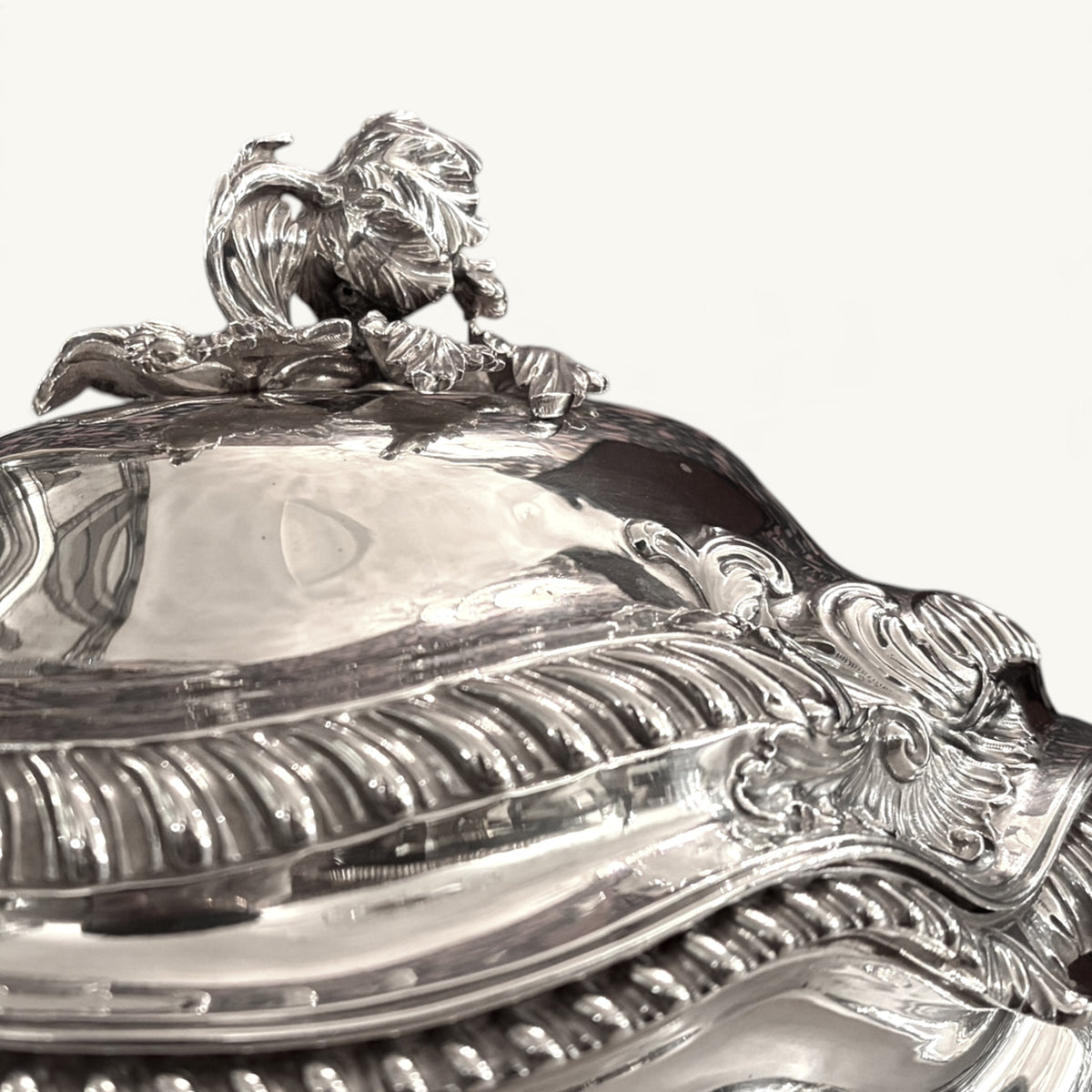 KLS Vaults Victorian silver soup tureen cover featuring a detailed artichoke finial and ornate gadrooned rim.