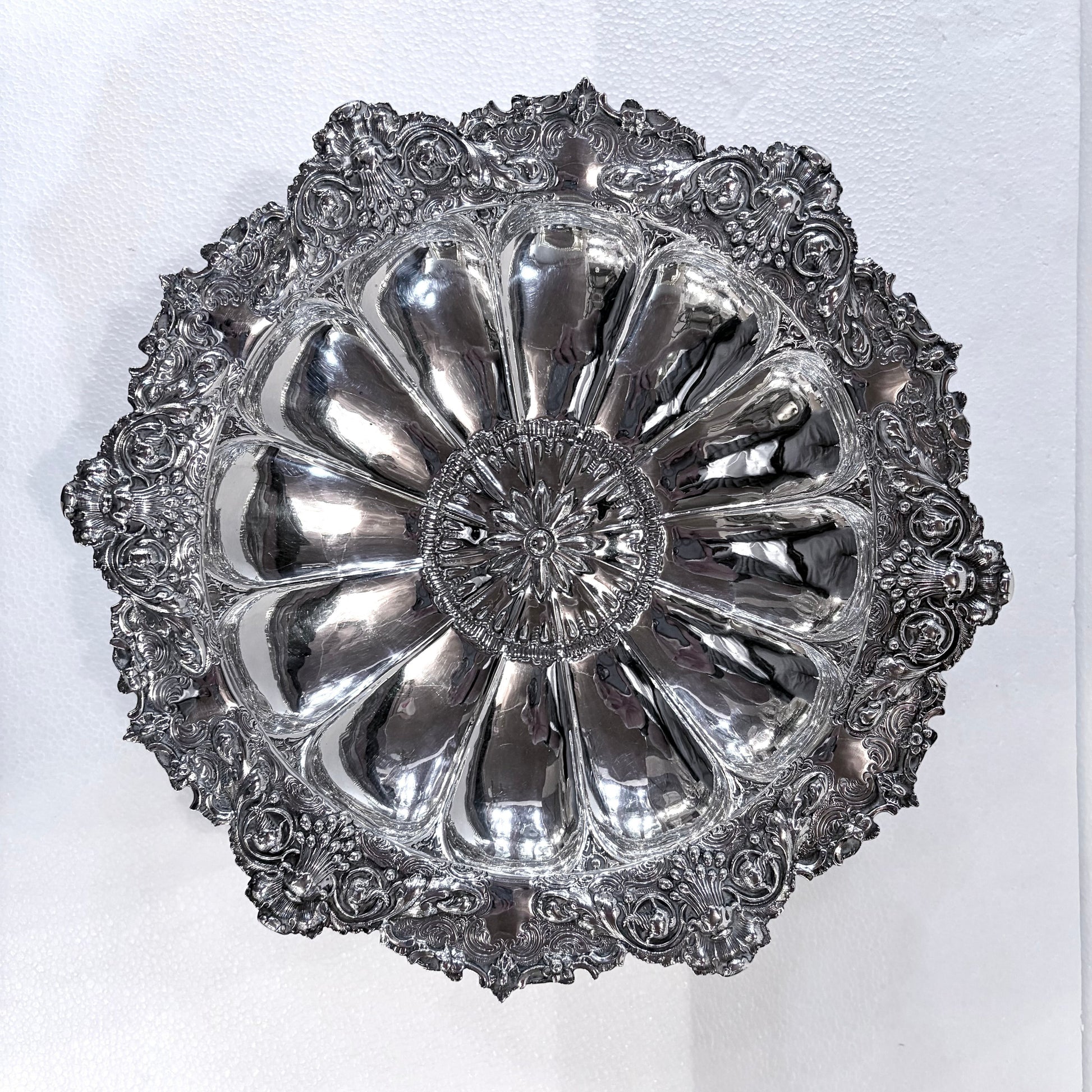 KLS Vaults Victorian sterling silver centerpiece bowl with intricate repoussé floral motifs and scalloped rim.